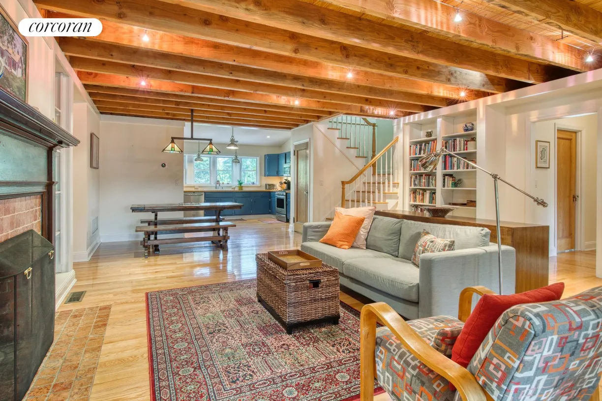 The Hamptons Real Estate | View 99 S Midway Road | living room with dining area