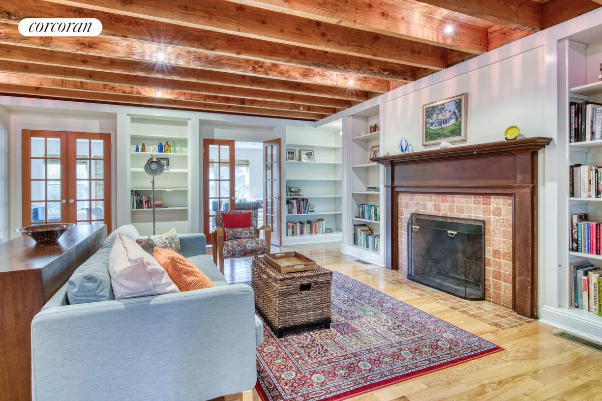 The Hamptons Real Estate | View 99 S Midway Road | living room with fireplace