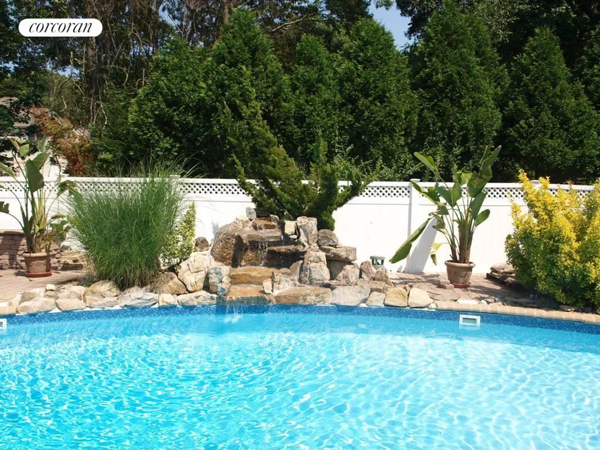 The Hamptons Real Estate | View 355 Windjammer Drive | Lagoon Pool