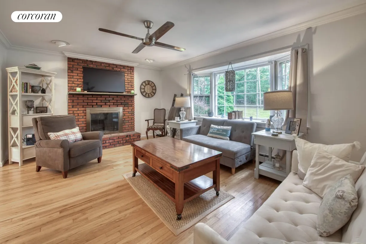 The Hamptons Real Estate | View 11F Petticoat Lane | Living room with fireplace