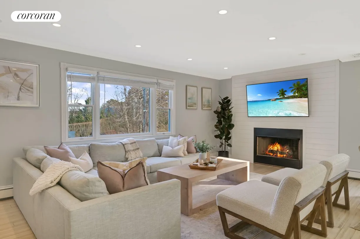 The Hamptons Real Estate | View 36 Charla Drive | Living Room with Fireplace