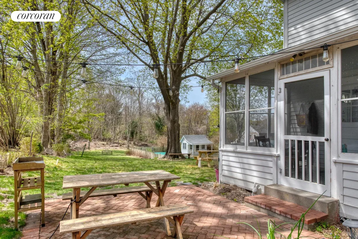 The Hamptons Real Estate | View 57 North Menantic Road | Patio with door to sunporch