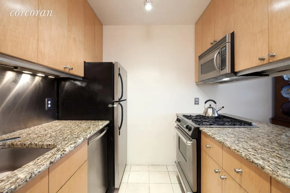 New York City Real Estate | View 167 Perry Street, 6C | Pass-thru kitchen with stainless steel back splash