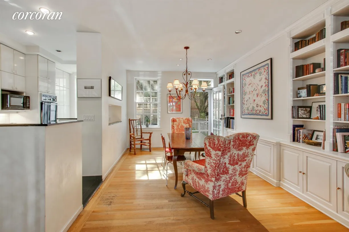 New York City Real Estate | View 45 Willow Place | Dining room with open kitchen and door to garden