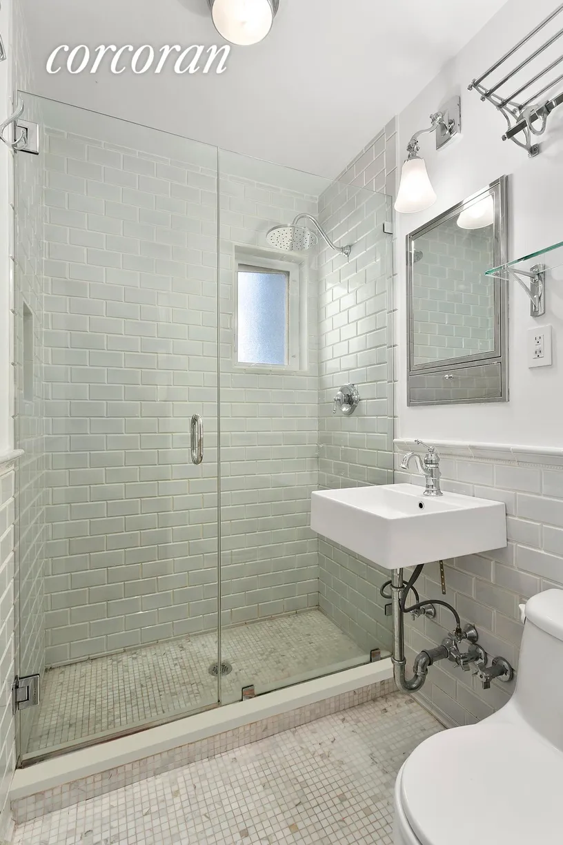 New York City Real Estate | View 362 West 20th Street, 4 | Beautiful Marble Bath with Glass Shower