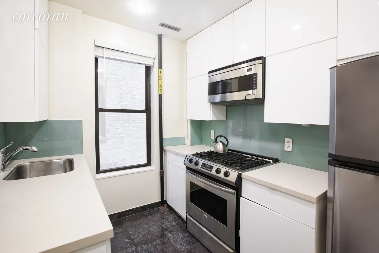 New York City Real Estate | View 137 West 12th Street, 2-3 | Windowed kitchen with stainless steel appliances