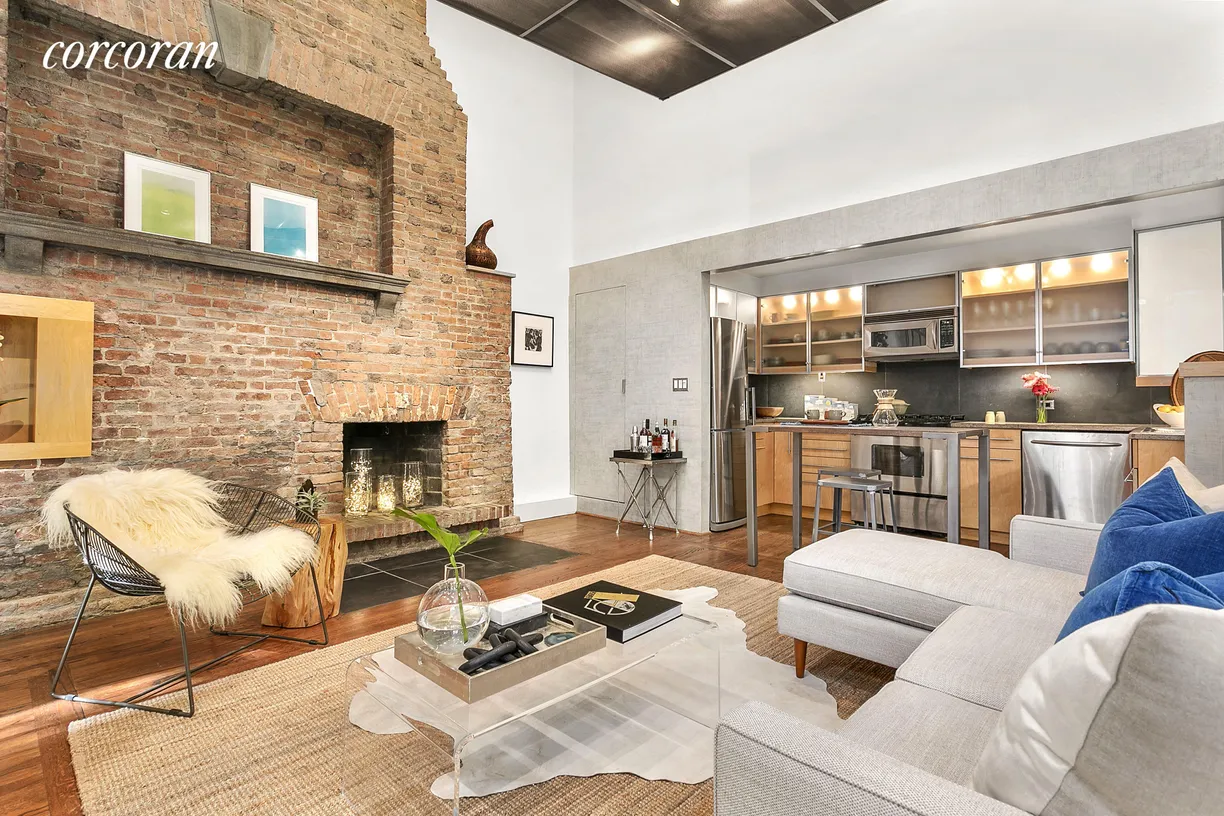 New York City Real Estate | View 131 West 11th Street, 2 | Living Room + Wood-Burning Fireplace