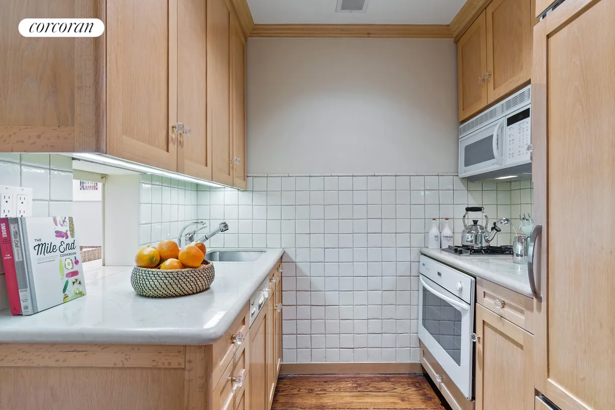 New York City Real Estate | View 470 West 24th Street, 16J | Kitchen has pass-thru to living room