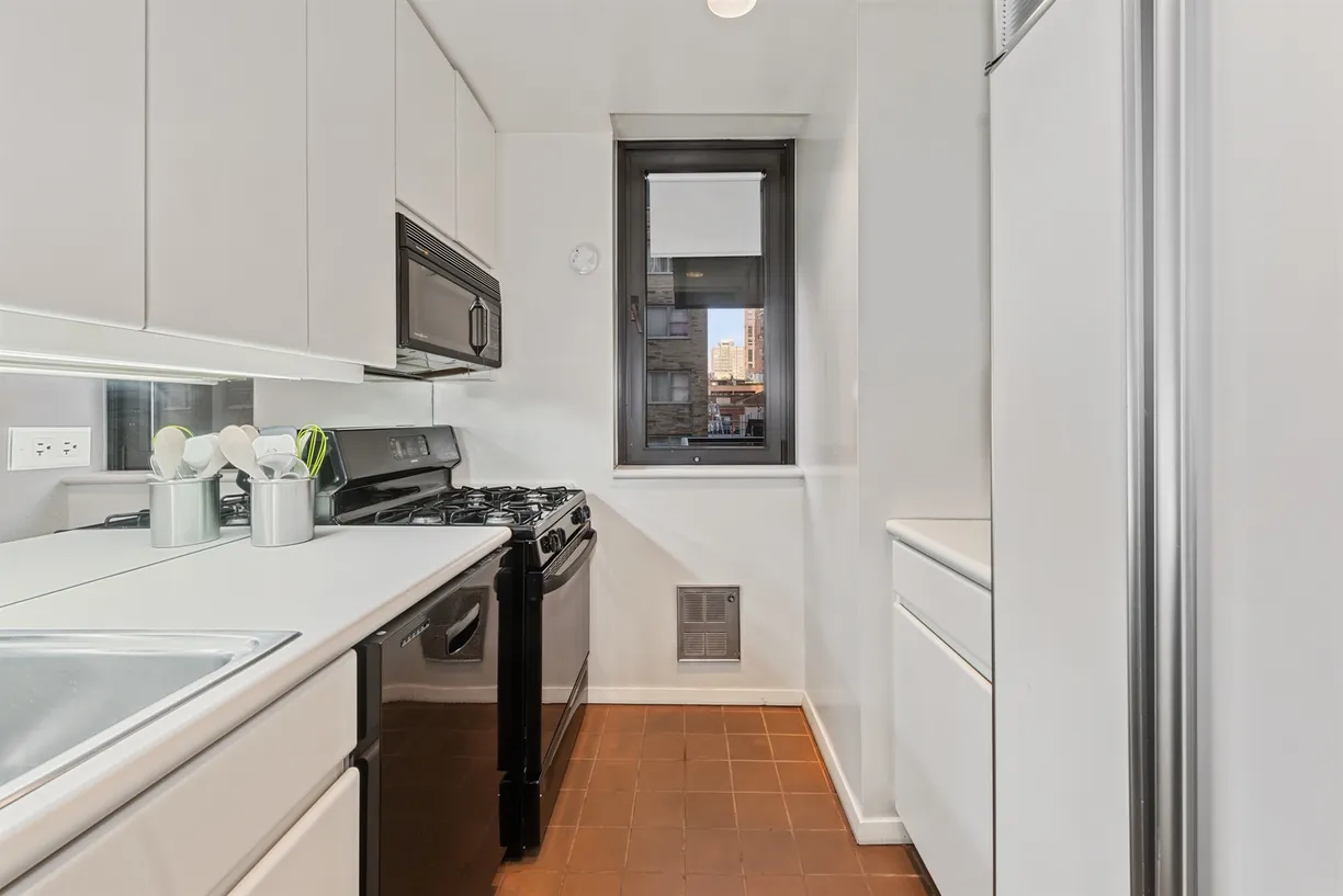 New York City Real Estate | View 100 United Nations Plaza, 7G | Windowed galley kitchen