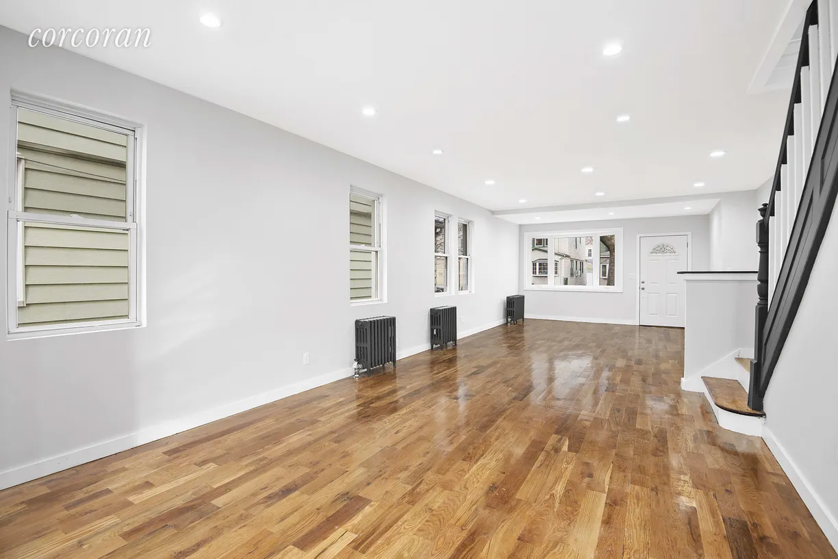 New York City Real Estate | View 69-24 66th Place | Massive living spaces, flooded with light!