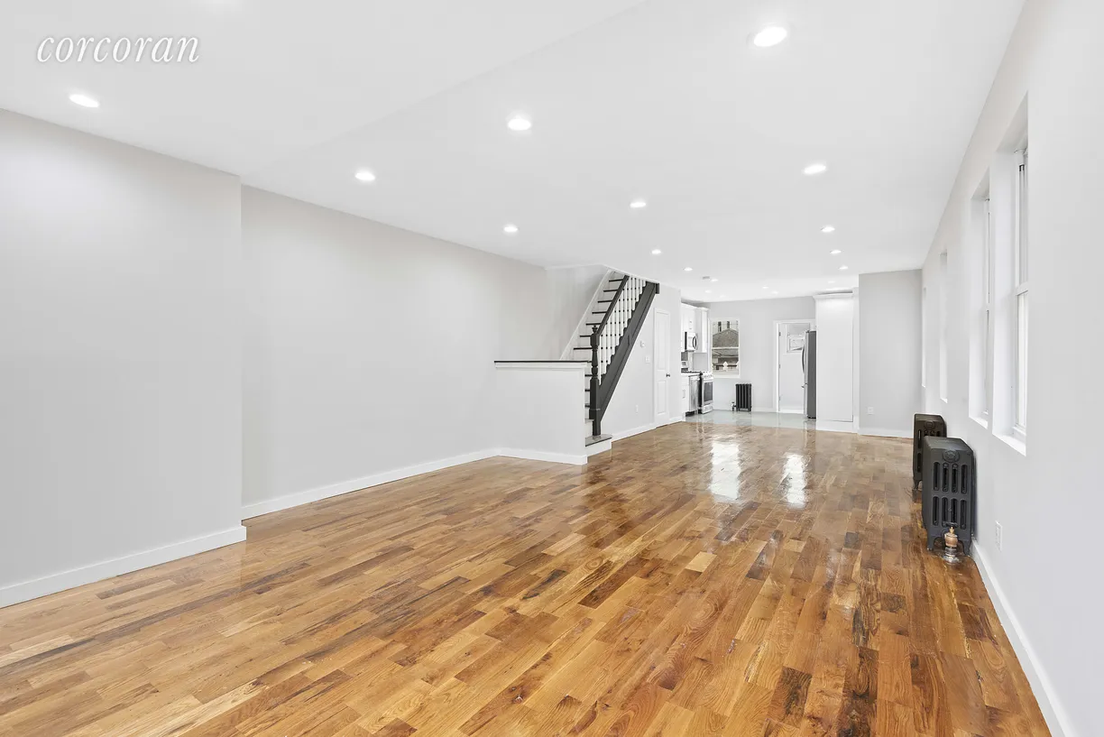 New York City Real Estate | View 69-24 66th Place | Elegant stairwell leading to bedrooms!