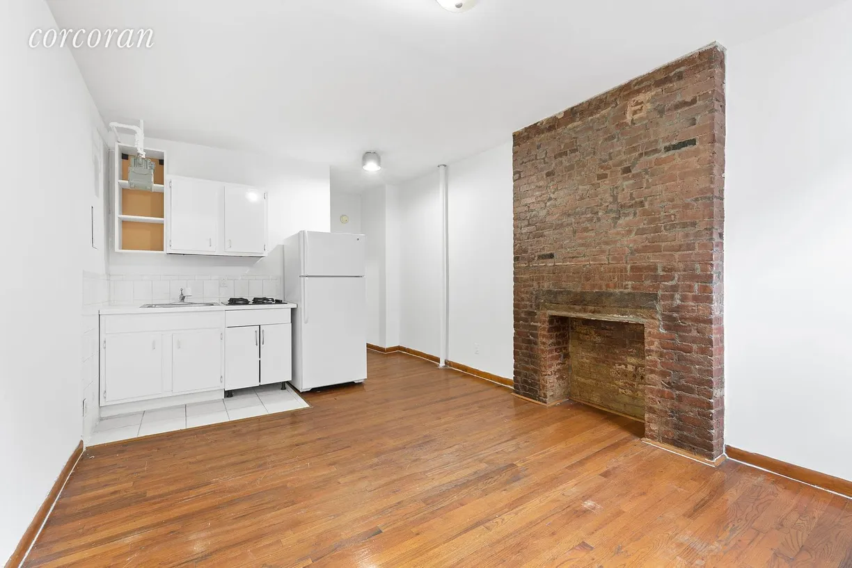 New York City Real Estate | View 136 Allen Street, 7 | Nice open Kitchen and Dec Fireplace