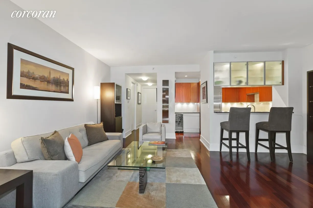 New York City Real Estate | View 300 East 55th Street, 5F | Living Room Facing Kitchen