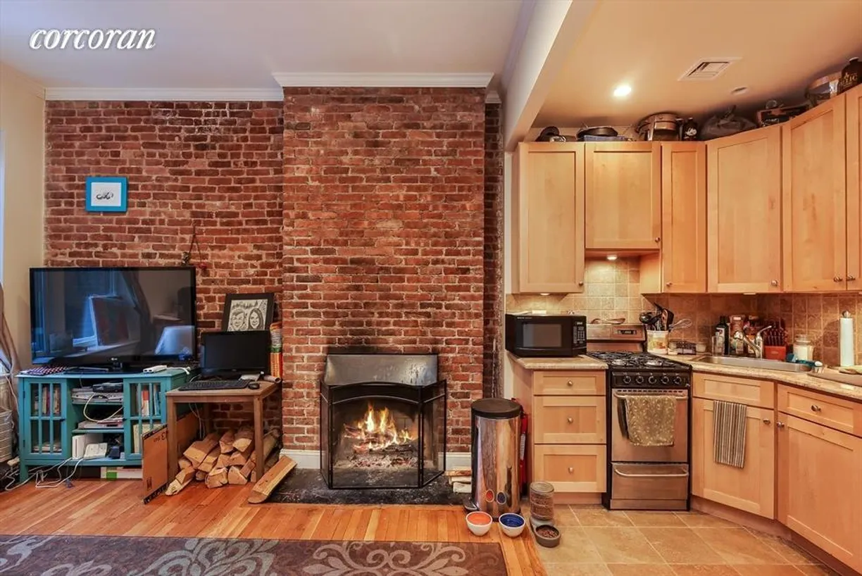 New York City Real Estate | View 158 West 94th Street, 2R | Working fireplace and renovated kitchen