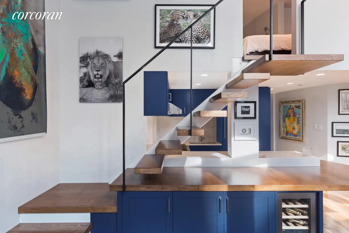 New York City Real Estate | View 67 East 11th Street, 323 | Kitchen/Staircase