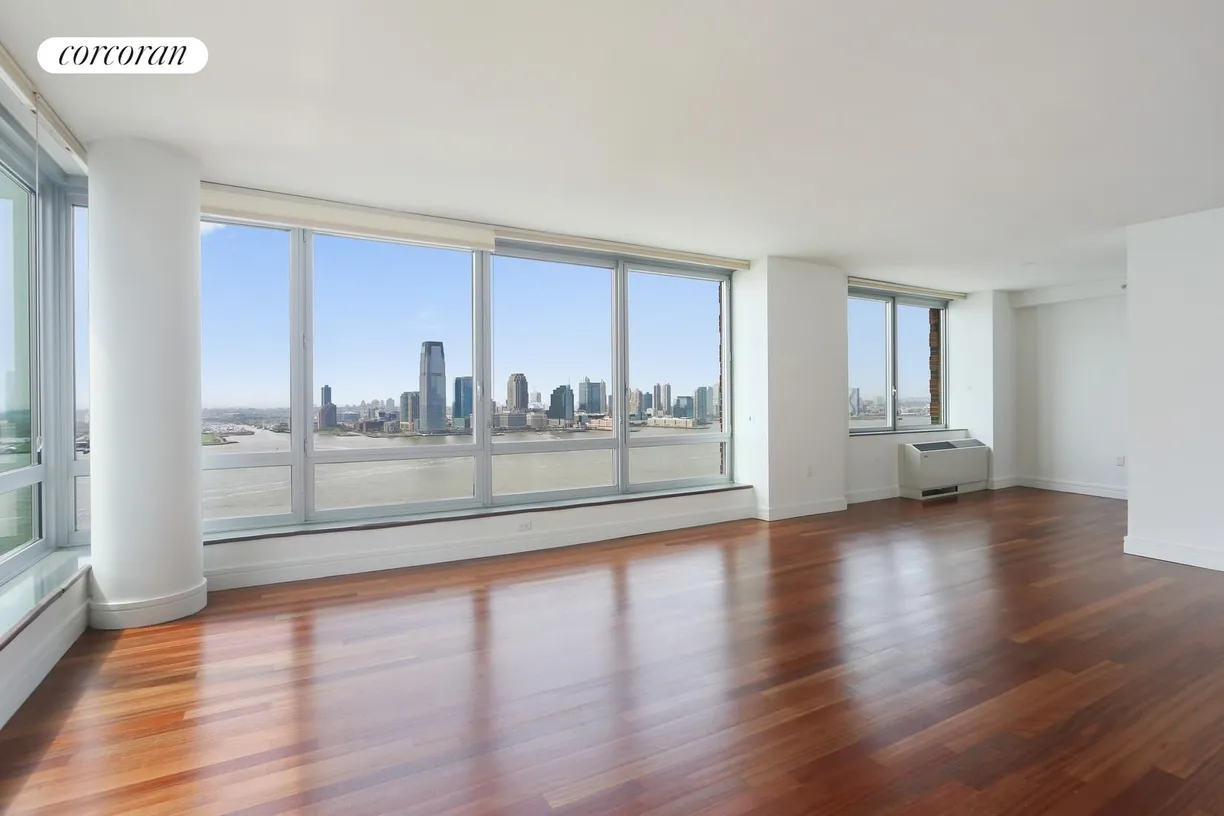New York City Real Estate | View 30 West Street, 29F | Living Room with Direct Hudson Rive