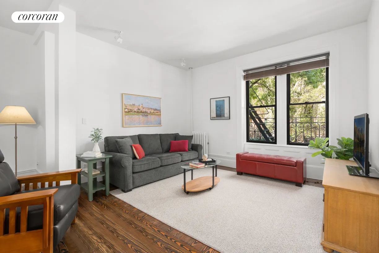 New York City Real Estate | View 234 West 21st Street, 21 | Large Living Room w/ Treetop Views