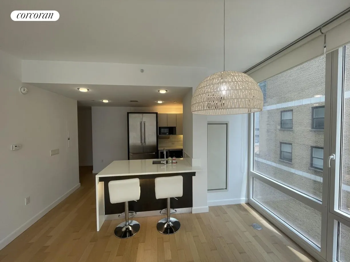New York City Real Estate | View 247 West 46th Street, 1104 | Kitchen and eat on island