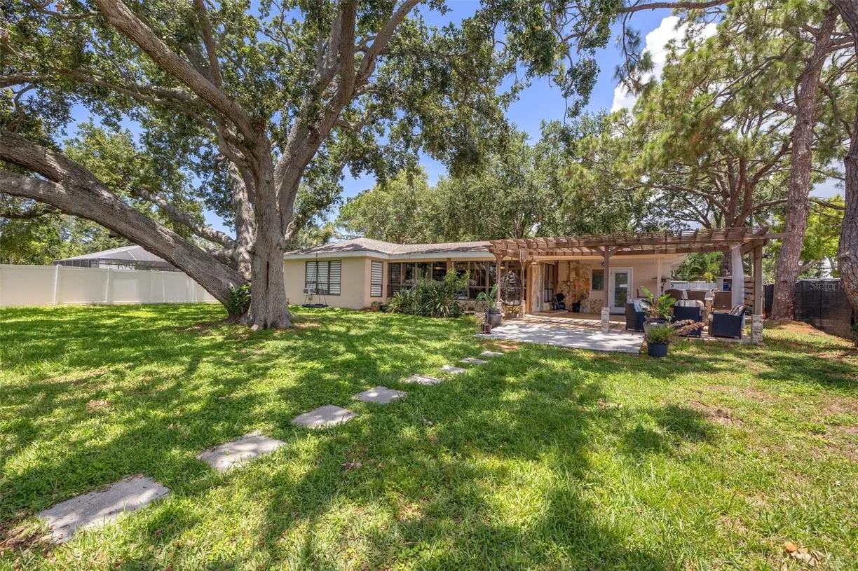 Sarasota/St. Petersburg Real Estate | View 10730 52nd Avenue N | 4 Beds, 2 Baths
