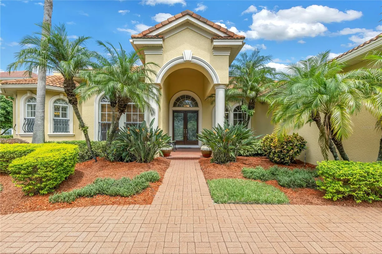 Sarasota/St. Petersburg Real Estate | View 9818 Tree Tops Lake Road | 4 Beds, 3 Baths
