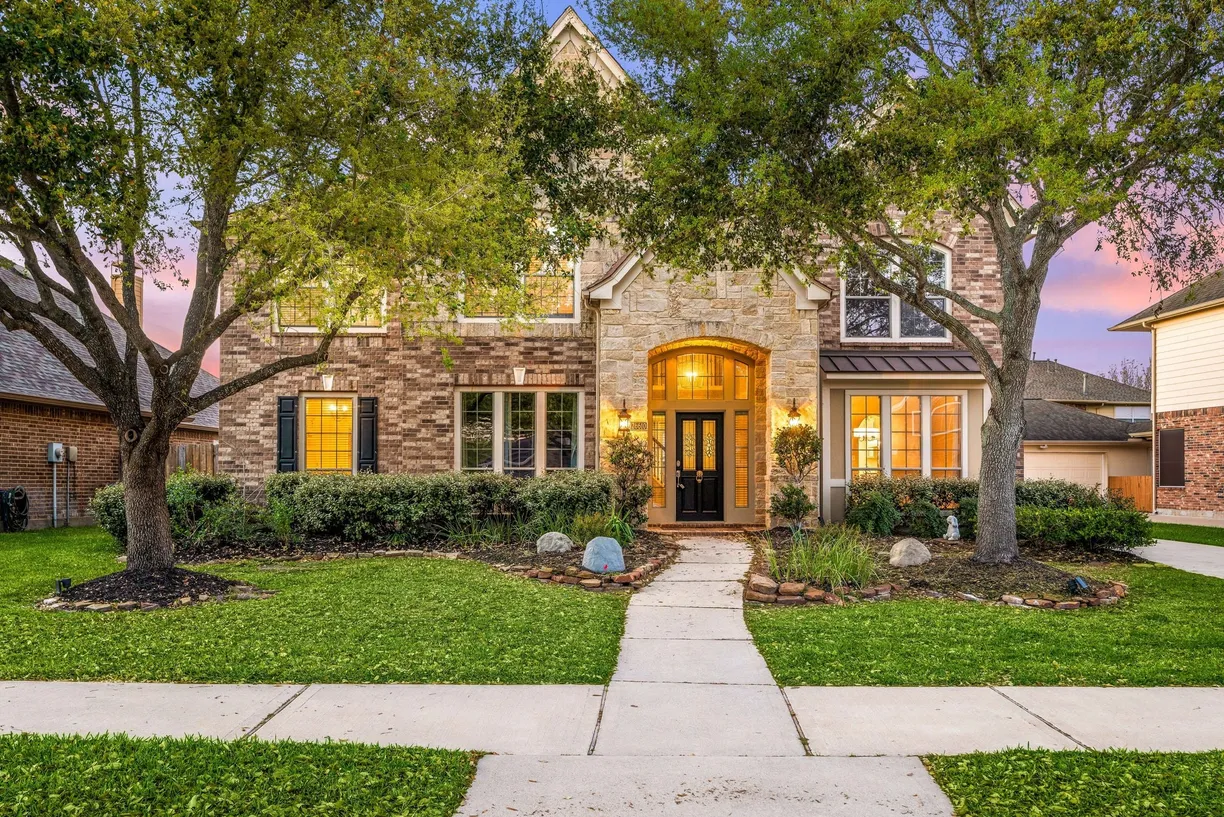 Houston Suburbs Real Estate | View 26610 Godfrey Cove Court | 4 Beds, 3 Baths