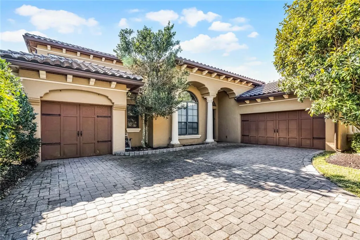 Central Florida Real Estate | View 7505 Pointe Venezia Drive | 5 Beds, 4 Baths