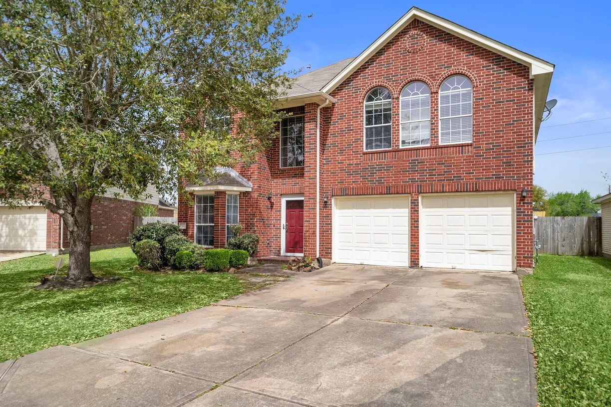 Houston Suburbs Real Estate | View 1122 N Magnolia Dale Drive | 4 Beds, 2 Baths