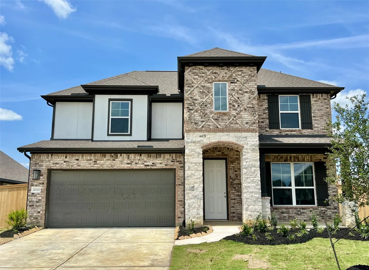 Houston Suburbs Real Estate | View 32302 Mimosa Ridge Lane | 4 Beds, 3 Baths