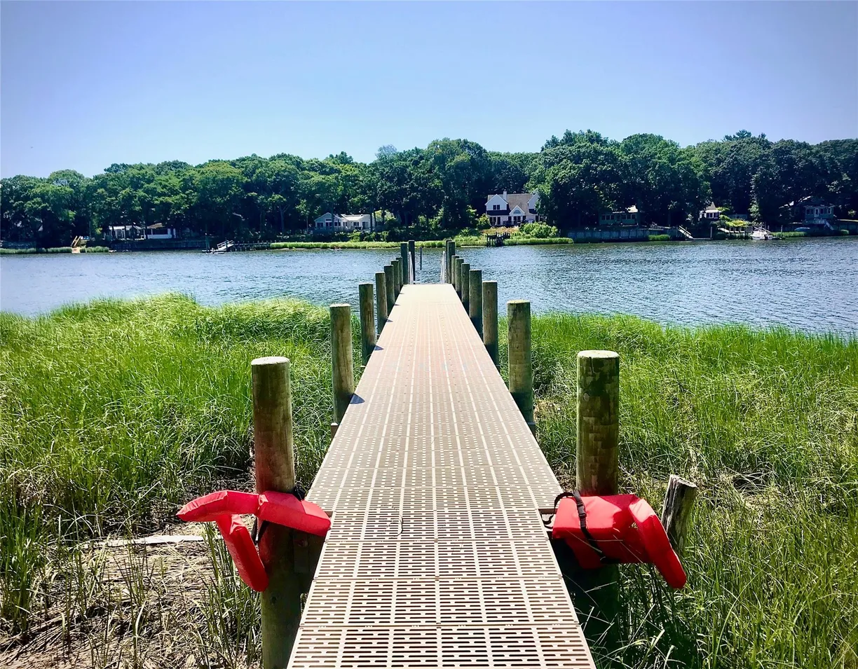The Hamptons Real Estate | View 3705 Wells Road | 2 Beds, 2 Baths