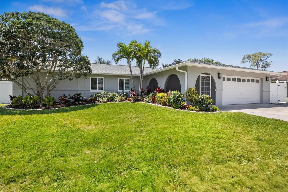 Sarasota/St. Petersburg Real Estate | View 14128 SPOONBILL LANE | 4 Beds, 3 Baths