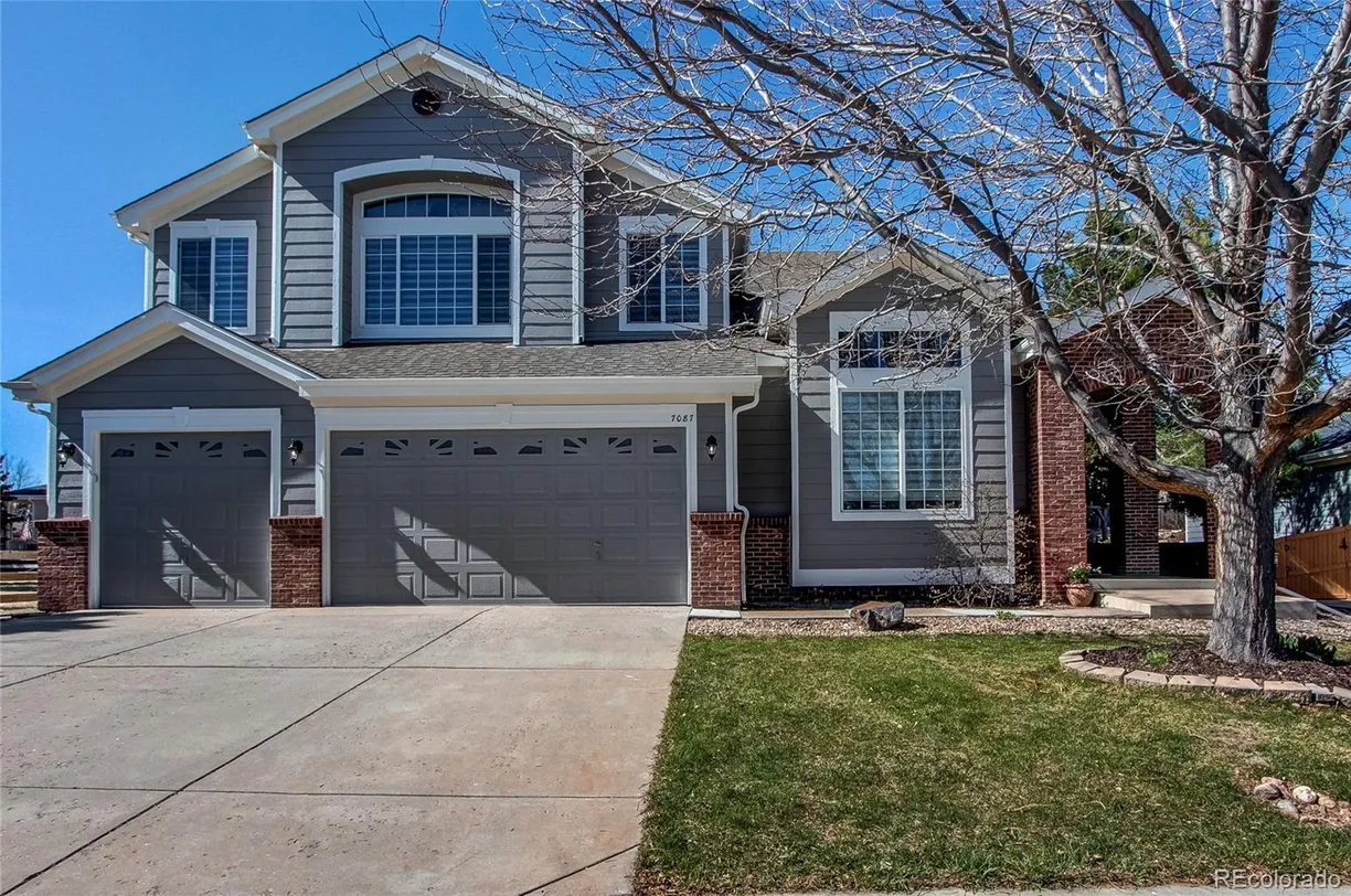 Denver Real Estate | View 7087 Sapphire Pointe Boulevard | 5 Beds, 3 Baths