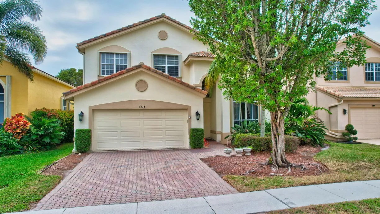 South Florida Real Estate | View 7518 Colony Lake Drive | 4 Beds, 2 Baths