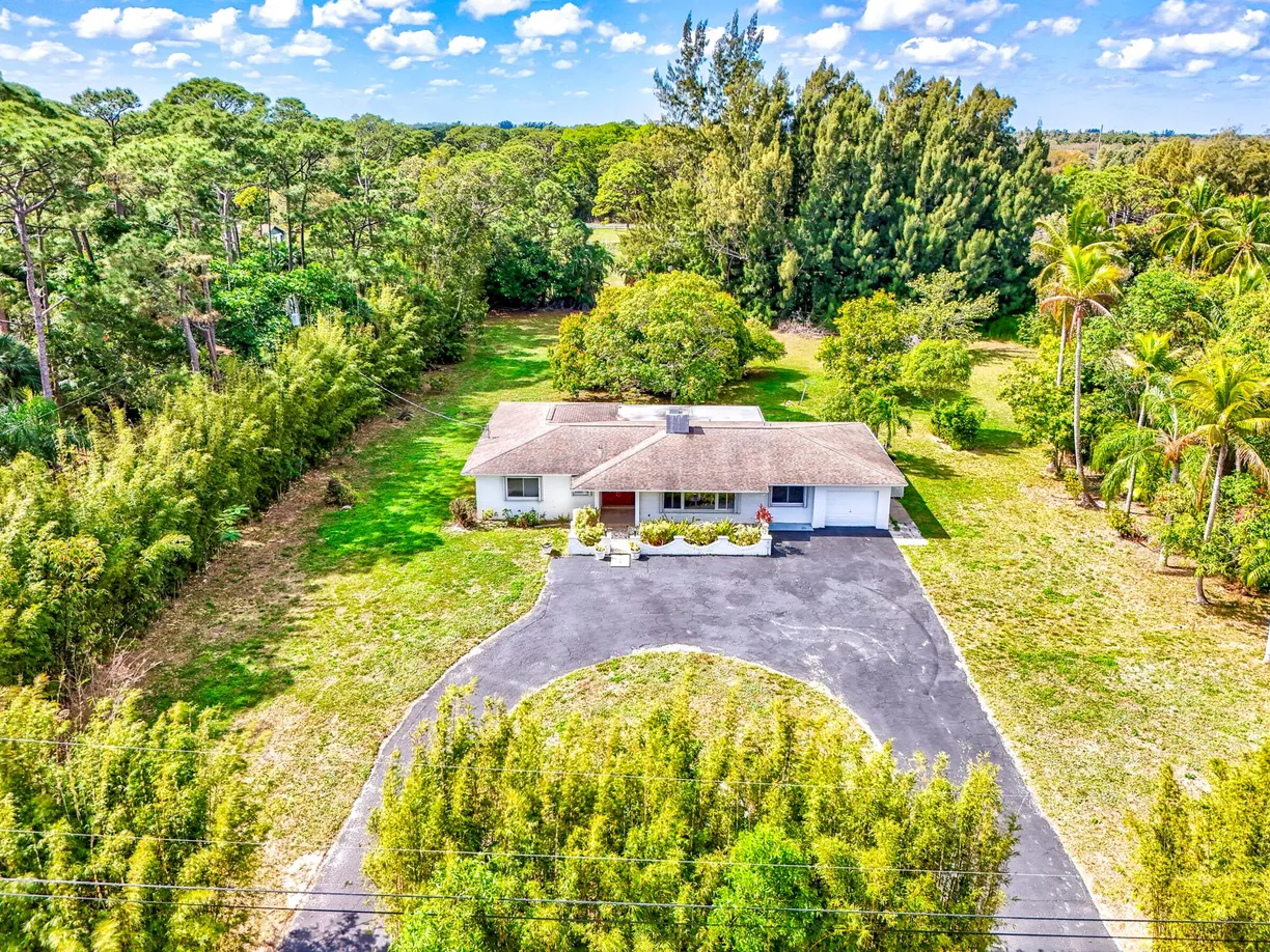 South Florida Real Estate | View 8902 N Bates Road | 4 Beds, 3 Baths