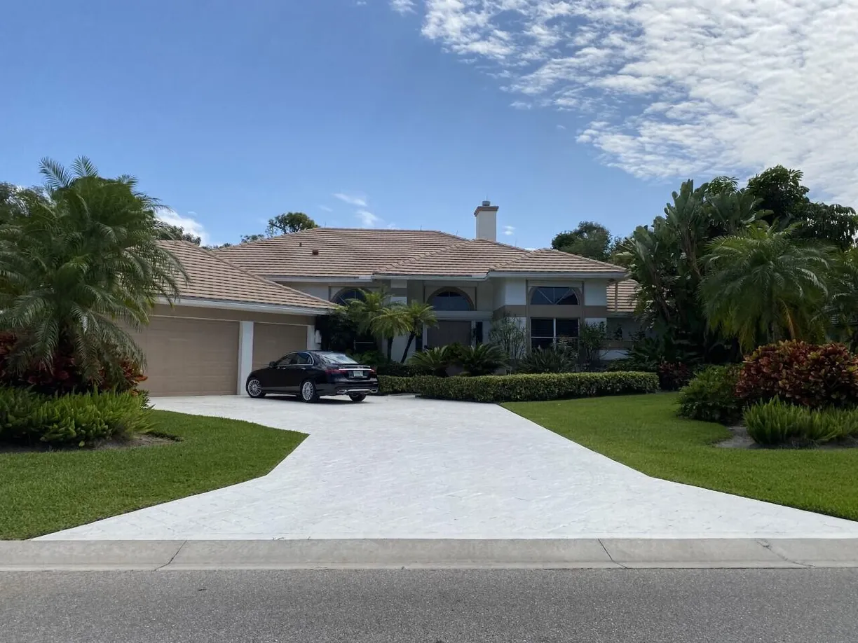 South Florida Real Estate | View 1297 Breakers West Boulevard | 4 Beds, 3 Baths