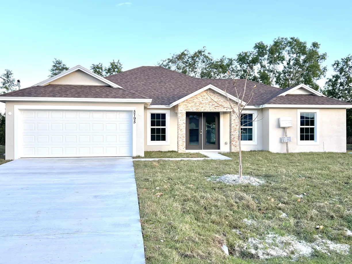 South Florida Real Estate | View 5795 NW Coosa Drive | 4 Beds, 2 Baths