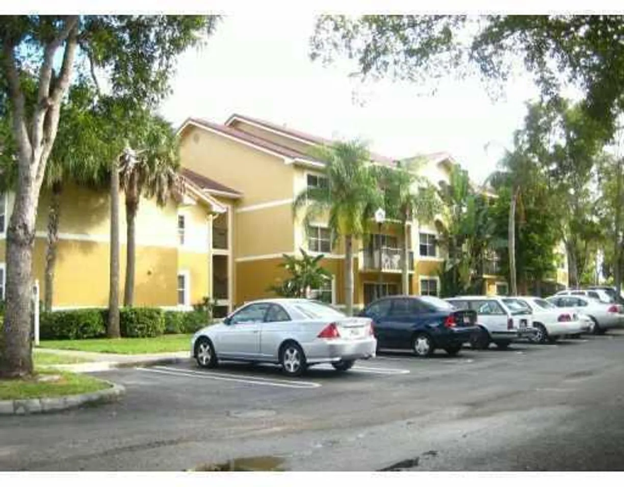 South Florida Real Estate | View 8801 Wiles Road, 302 | 3 Beds, 2 Baths