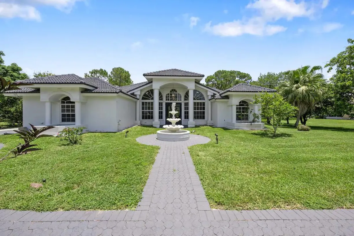 South Florida Real Estate | View 6670 Royal Palm Beach Boulevard | 4 Beds, 2 Baths