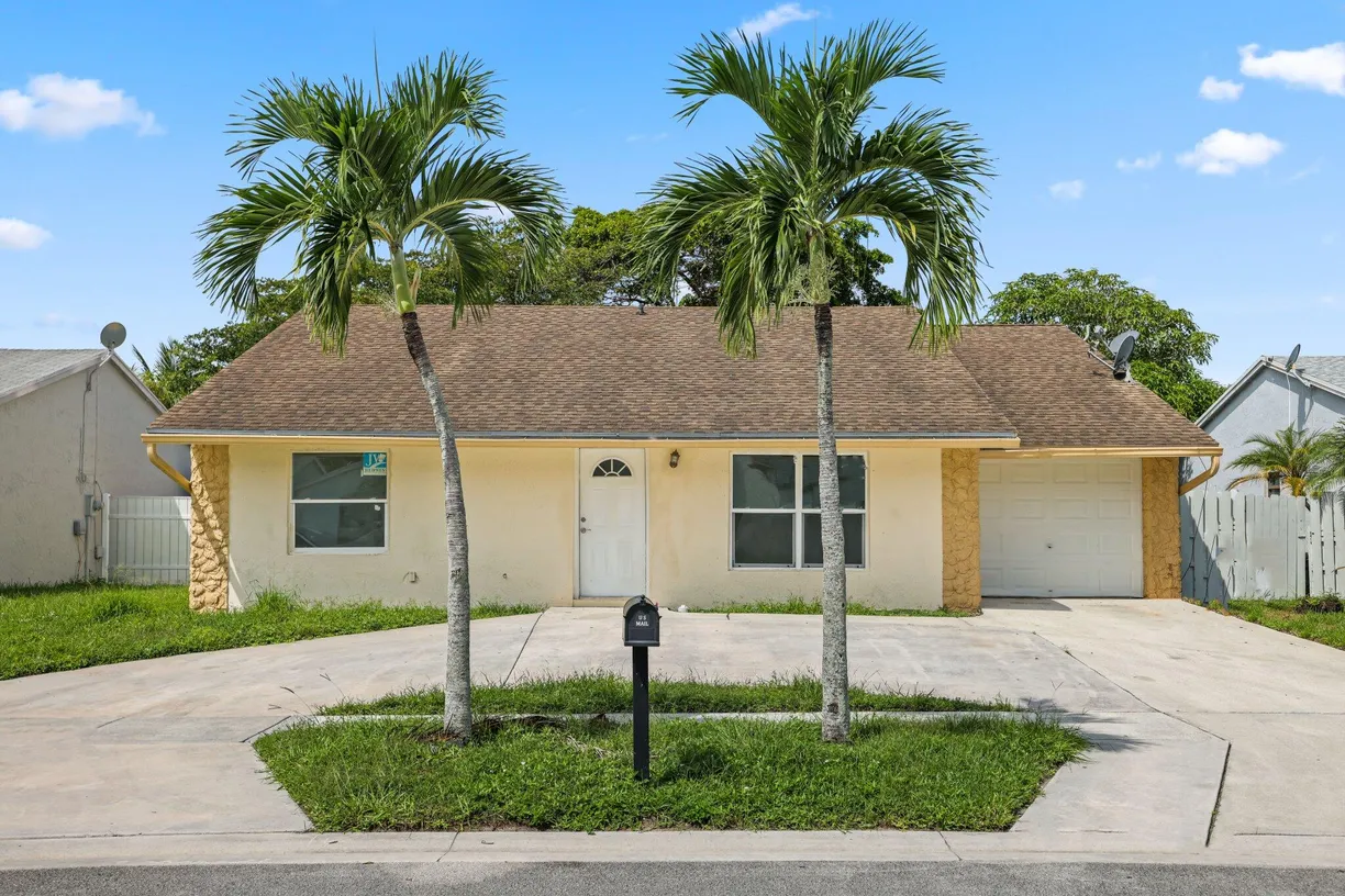 South Florida Real Estate | View 6009 Triphammer Road | 4 Beds, 2 Baths