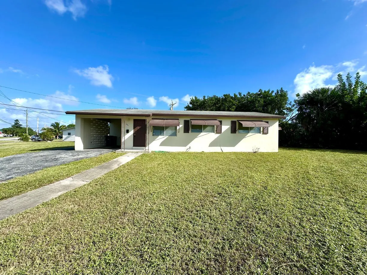 South Florida Real Estate | View 861 W Ilex Drive | 3 Beds, 2 Baths