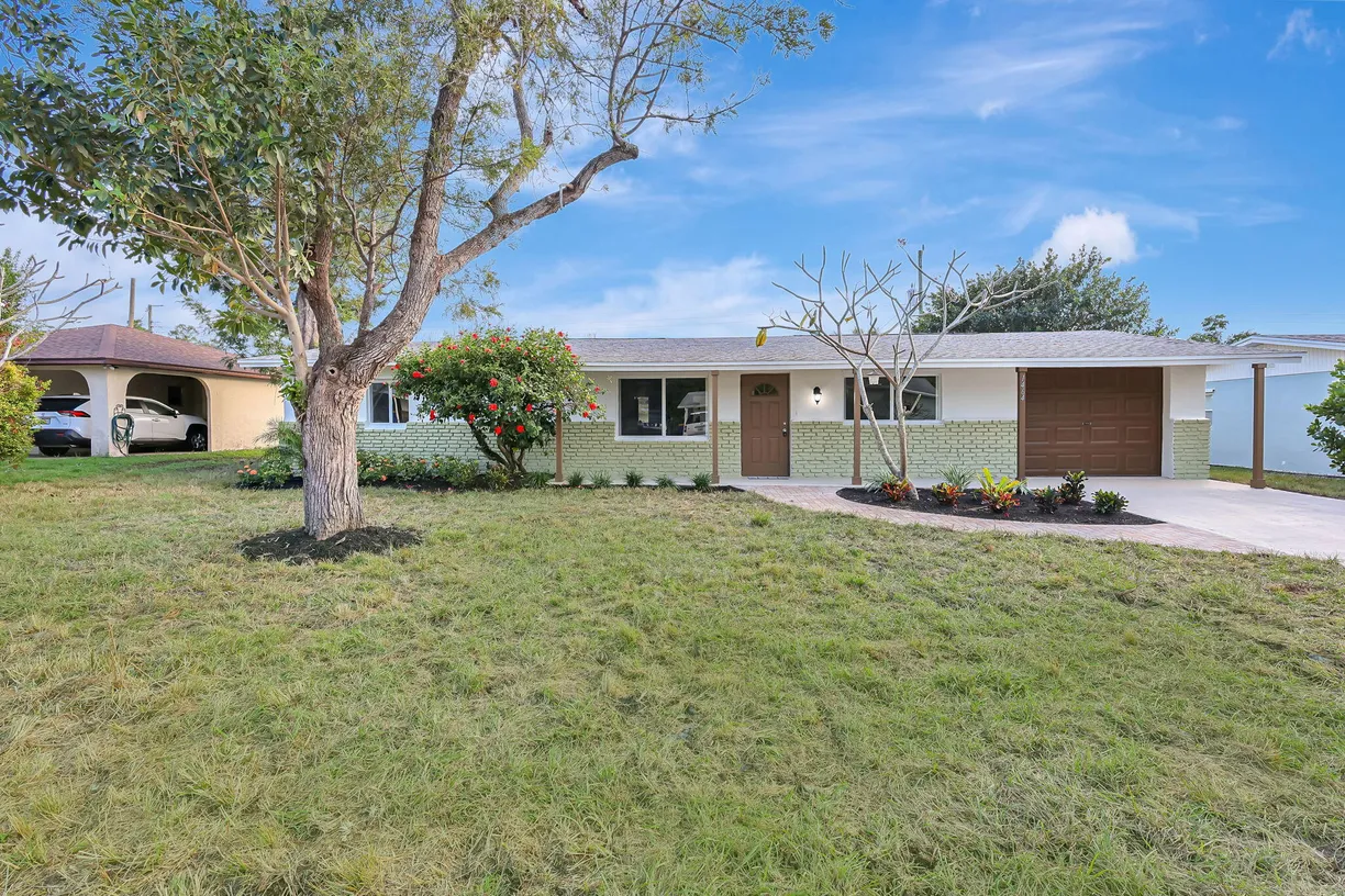 South Florida Real Estate | View 1464 NE Croton Street | 4 Beds, 2 Baths