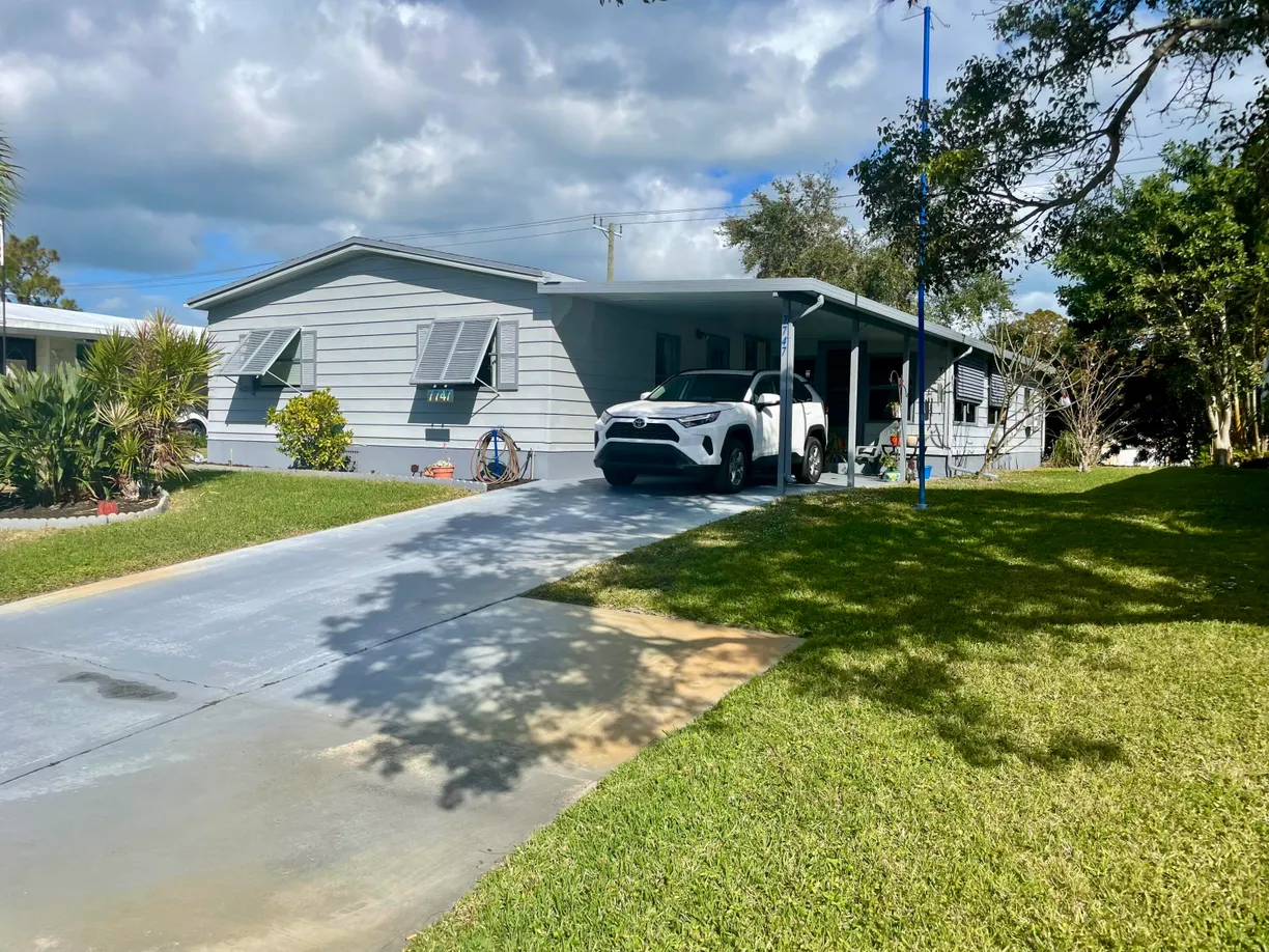 South Florida Real Estate | View 7747 SE Continental Drive | 3 Beds, 2 Baths