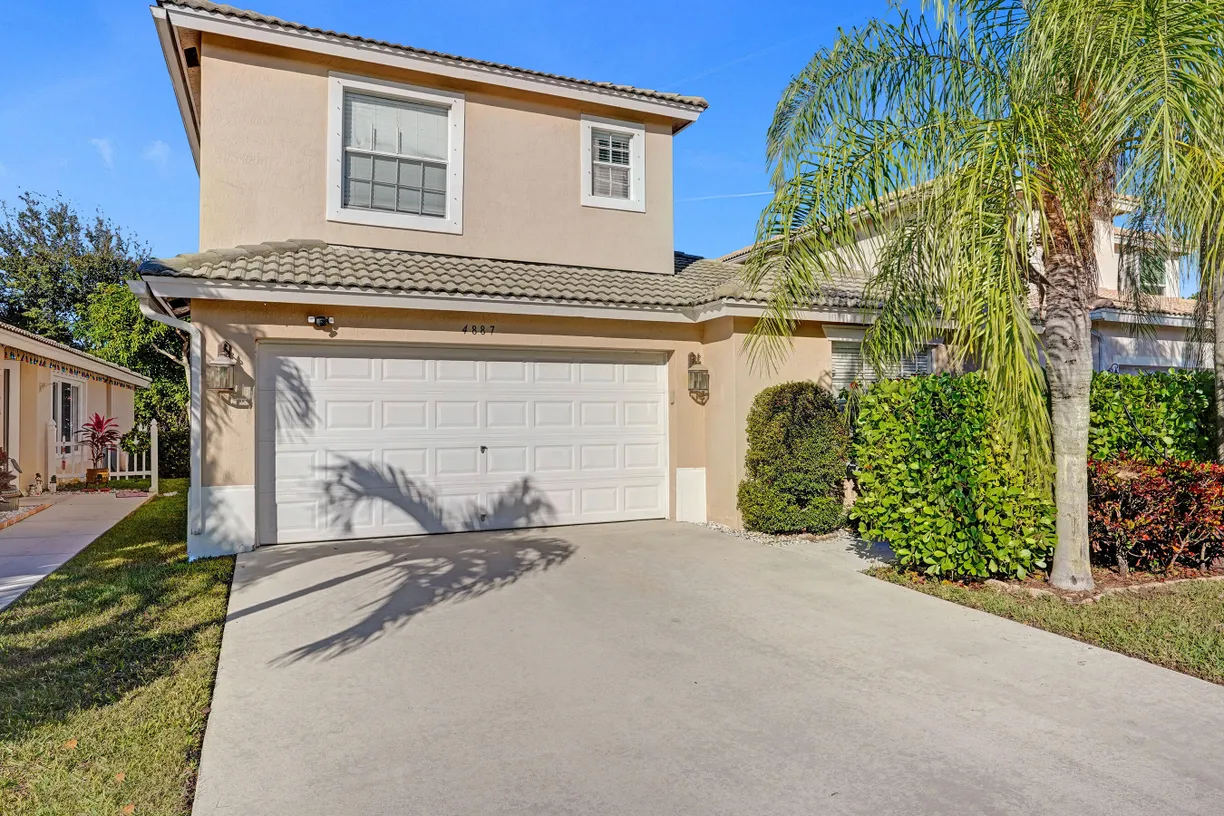 South Florida Real Estate | View 4887 Lombard Pass Drive | 4 Beds, 3 Baths