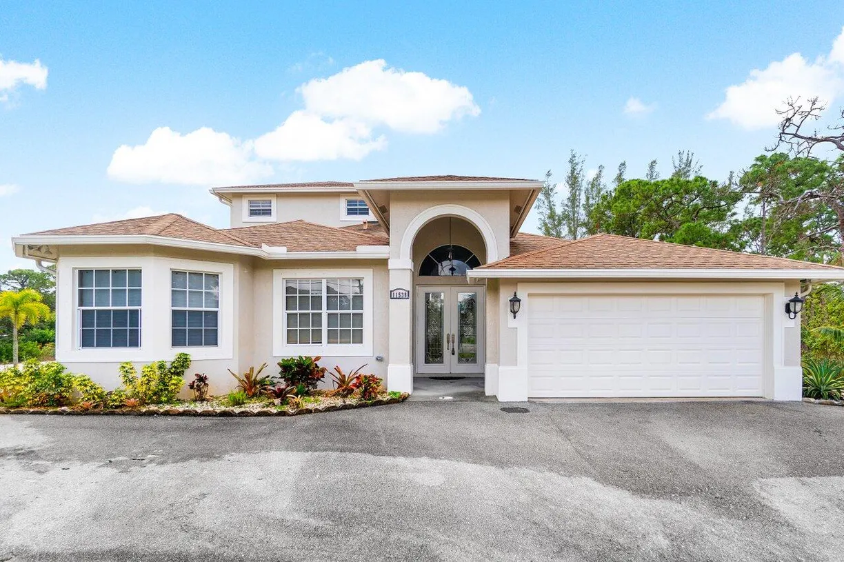 South Florida Real Estate | View 11538 Persimmon Boulevard | 4 Beds, 4 Baths