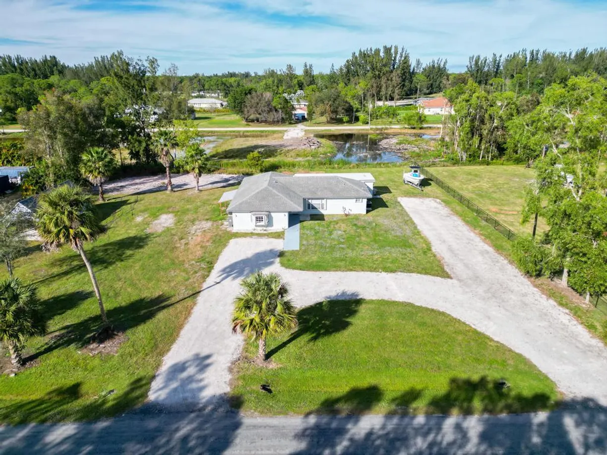 South Florida Real Estate | View 12575 58th Place | 3 Beds, 2 Baths