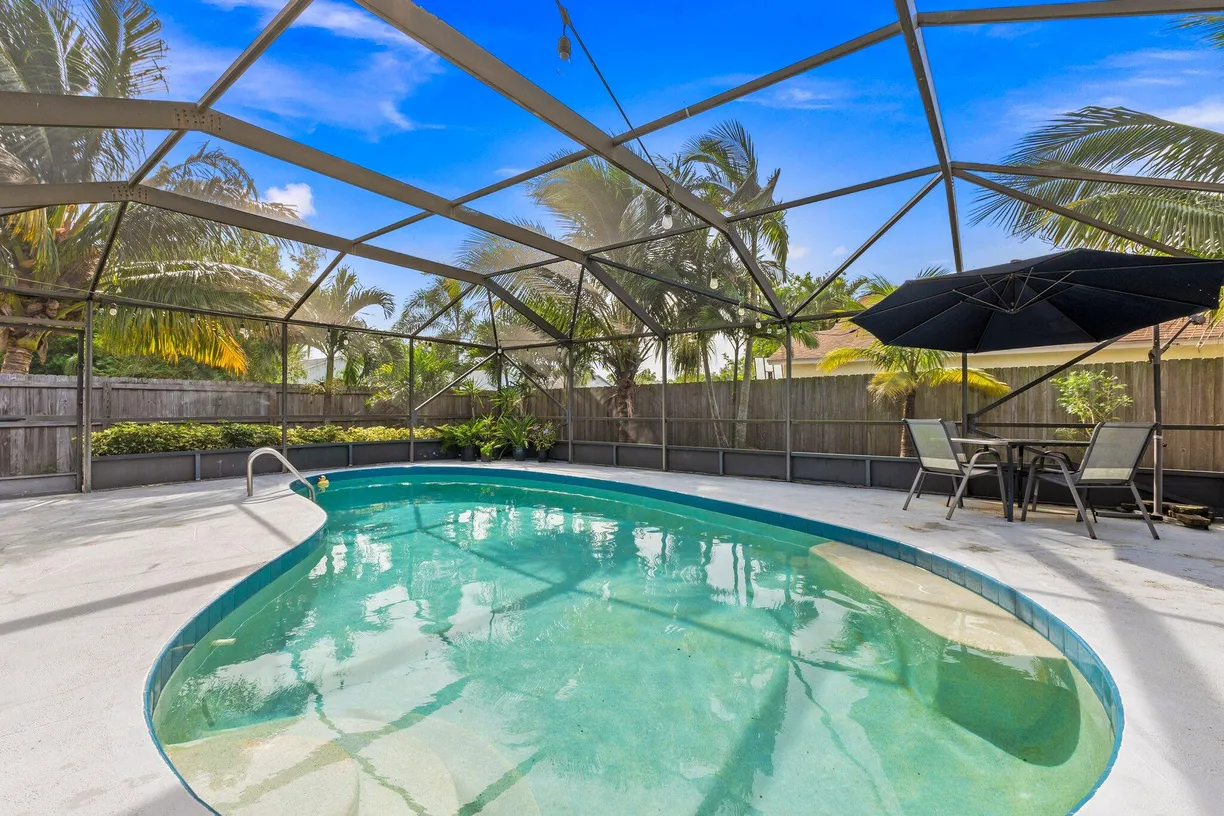 South Florida Real Estate | View 5280 SE Dell Street | 4 Beds, 2 Baths