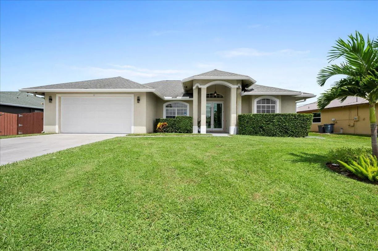 South Florida Real Estate | View 111 SW Milburn Circle | 4 Beds, 2 Baths