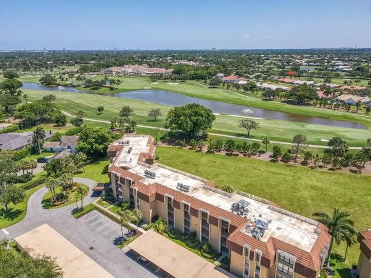 South Florida Real Estate | View 5350 Woodland Lakes Drive, 209 | 2 Beds, 2 Baths