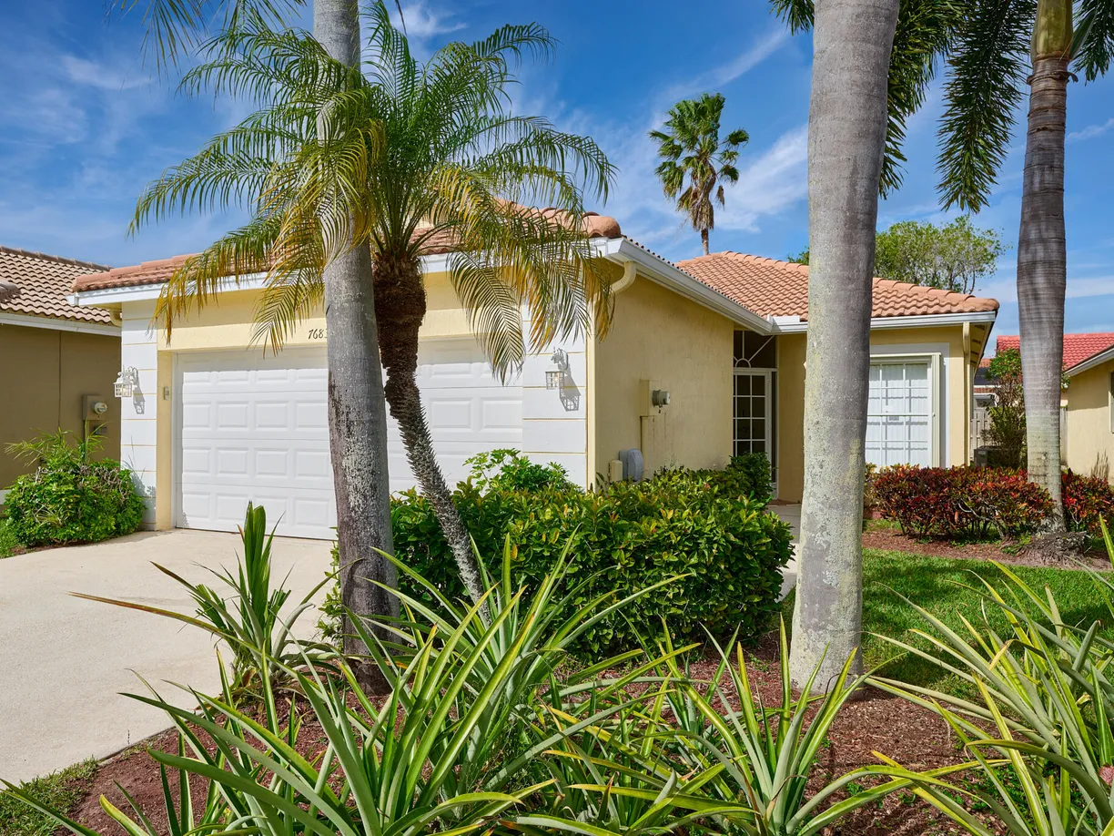 South Florida Real Estate | View 7683 Cherry Blossom Way | 3 Beds, 2 Baths