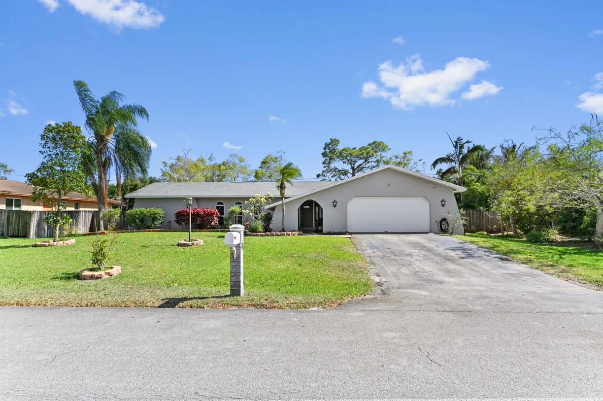 South Florida Real Estate | View 25 W Plumosa Lane | 4 Beds, 2 Baths