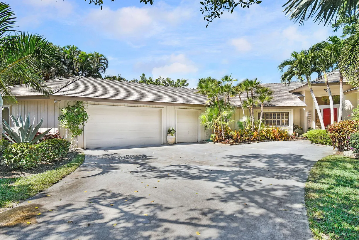 South Florida Real Estate | View 5711 SE Winged Foot Drive | 4 Beds, 3 Baths